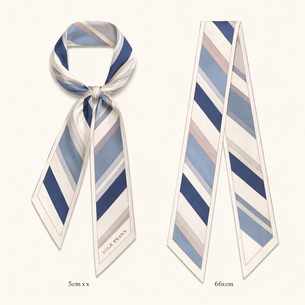 Design a 5cm x 86cm silk twill scarf for Jolie Franc with a classic Ivy League aesthetic and subtle feminine refinement. Feature tonal ribbon stripes inspired by traditional menswear neckties, softened in scale and color. Use warm ivory, navy, pale blue-grey, and a whisper of dusty rose. Minimal border, hand-rolled edges. Timeless, polished, and elegant, designed for a Kelly-style bag handle or refined everyday wear.
Design a 5cm x 86cm silk twill scarf for Jolie Franc with a classic Ivy League aesthetic and subtle feminine refinement. Feature tonal ribbon stripes inspired by traditional menswear neckties, softened in scale and color. Use warm ivory, navy, pale blue-grey, and a whisper of dusty rose. Minimal border, hand-rolled edges. Timeless, polished, and elegant, designed for a Kelly-style bag handle or refined everyday wear., classic style, show front and back