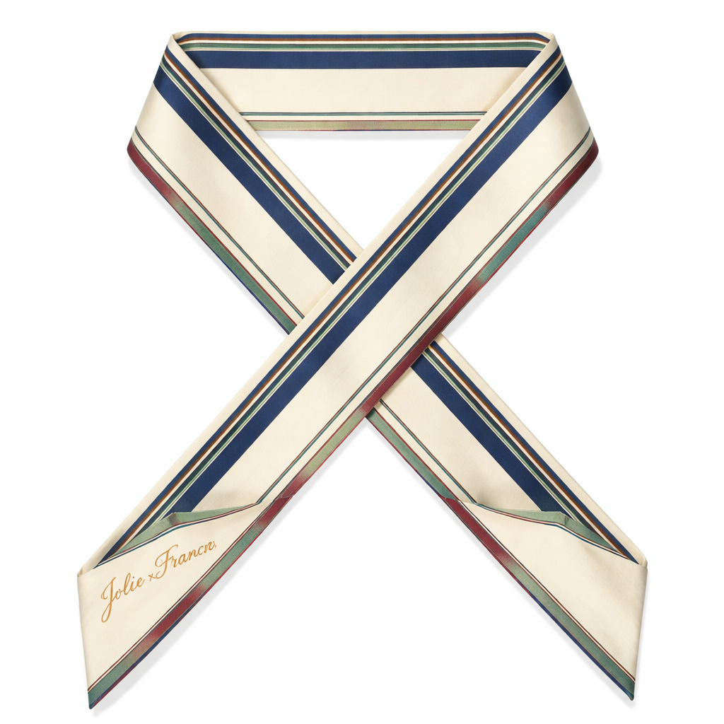 Design a 5cm x 86cm silk twill scarf for Jolie Franc, blending American preppy structure with British tailoring and a subtle feminine touch. This scarf is for evening outings. Feature narrow, structured stripes in deep navy and slate blue. Include subtle painterly accents along the edges in muted burgundy, soft emerald, and antique gold to catch soft evening light. Base color: warm ivory or cream. Add a thin framed border and hand-rolled edges. The design should be polished, timeless, and instantly recognizable when wrapped around a Kelly-style bag handle or worn for sophisticated evening wear.
Design a 5cm x 86cm silk twill scarf for Jolie Franc, blending American preppy structure with British tailoring and a subtle feminine touch. This scarf is for evening outings. Feature narrow, structured stripes in deep navy and slate blue. Include subtle painterly accents along the edges in muted burgundy, soft emerald, and antique gold to catch soft evening light. Base color: warm ivory or cream. Add a thin framed border and hand-rolled edges. The design should be polished, timeless, and instantly recognizable when wrapped around a Kelly-style bag handle or worn for sophisticated evening wear., classic style, show front and back