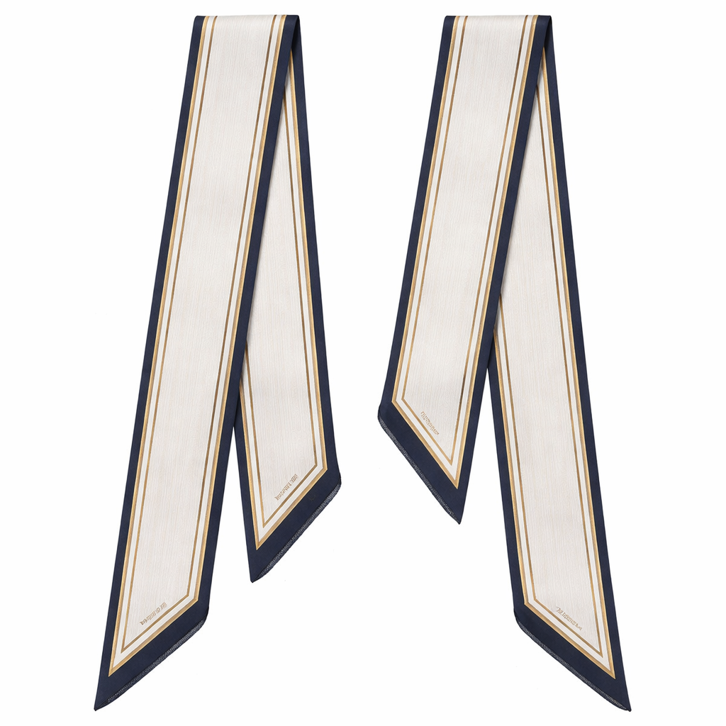 Design a 5cm x 86cm silk twill scarf for a luxury French brand called Jolie Franc. The design is classic, timeless, and tailored. Feature a precise double-line frame running the length of the scarf. Interior pattern should be architectural micro-stripes inspired by fine suiting. Color palette: ivory base with inky navy and muted antique gold accents. Hand-rolled edges. Minimal, structured, elegant, and instantly recognizable when wrapped around a Kelly-style bag handle or worn for evening.
Design a 5cm x 86cm silk twill scarf for a luxury French brand called Jolie Franc. The design is classic, timeless, and tailored. Feature a precise double-line frame running the length of the scarf. Interior pattern should be architectural micro-stripes inspired by fine suiting. Color palette: ivory base with inky navy and muted antique gold accents. Hand-rolled edges. Minimal, structured, elegant, and instantly recognizable when wrapped around a Kelly-style bag handle or worn for evening., classic style, show front and back
