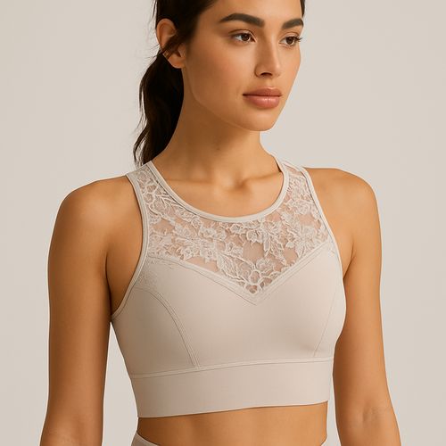 “Elegant women’s sports bra blending performance fabric with transparent lace details. Sculpting fit, floral lace overlay on neckline and straps, soft beige and white tones, premium seamless design, photographed in studio lighting, minimalist background.”