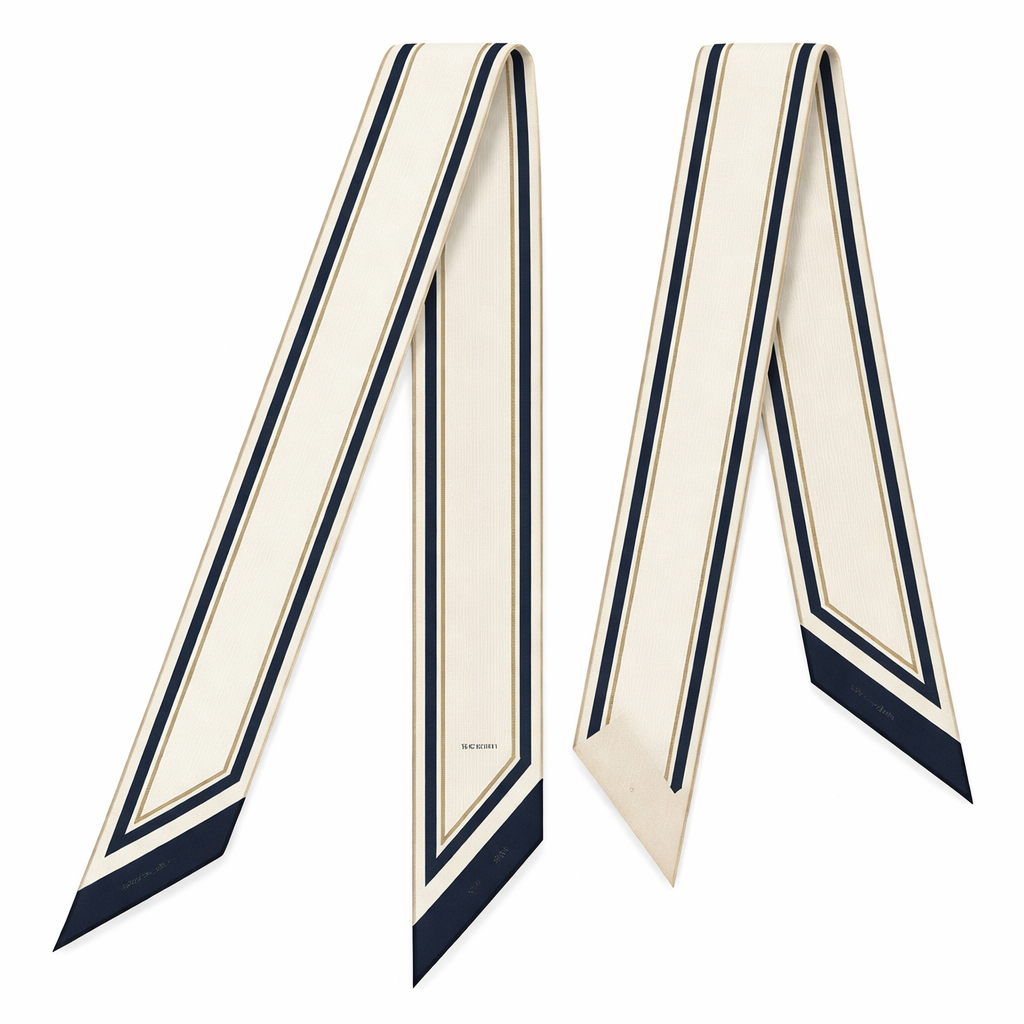 Design a 5cm x 86cm silk twill scarf for a luxury French brand called Jolie Franc. The design is classic, timeless, and tailored. Feature a precise double-line frame running the length of the scarf. Interior pattern should be architectural micro-stripes inspired by fine suiting. Color palette: ivory base with inky navy and muted antique gold accents. Hand-rolled edges. Minimal, structured, elegant, and instantly recognizable when wrapped around a Kelly-style bag handle or worn for evening.
Design a 5cm x 86cm silk twill scarf for a luxury French brand called Jolie Franc. The design is classic, timeless, and tailored. Feature a precise double-line frame running the length of the scarf. Interior pattern should be architectural micro-stripes inspired by fine suiting. Color palette: ivory base with inky navy and muted antique gold accents. Hand-rolled edges. Minimal, structured, elegant, and instantly recognizable when wrapped around a Kelly-style bag handle or worn for evening., classic style, show front and back